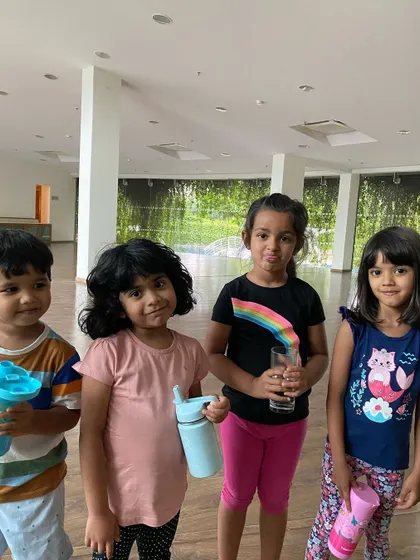 Time for a quick water break. Our classes are paced to match the energy levels of young children, with plenty of time for rest, sips of water, and chats with friends.