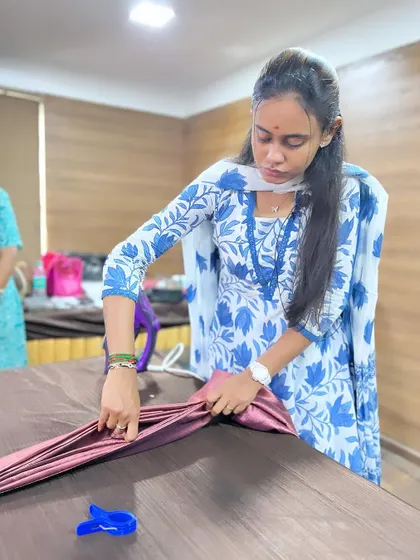 A close-up of the pre-pleating process. Using clips and an iron helps set the pleats perfectly for a flawless drape.