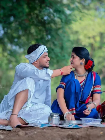 A tender moment captured during the picnic scene of the Shetkari shoot. His gentle touch and her calm expression make for a deeply romantic photograph.