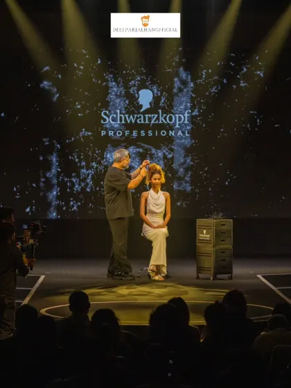 On stage for Schwarzkopf Professional, demonstrating an intricate updo in front of a live audience. These moments are about sharing the craft and passion behind creating trend-setting hairstyles.