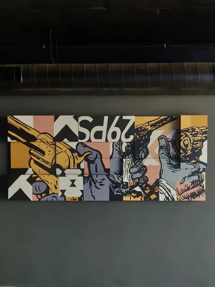 The completed pop art canvas installation hanging in its final location. This custom wall art piece is designed to be a major conversation starter.