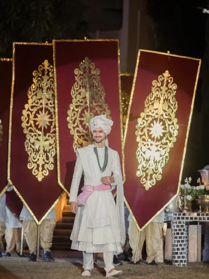 The groom, a picture of calm and happiness, as he walks towards his future, heralded by royal banners and the cheers of his loved ones.