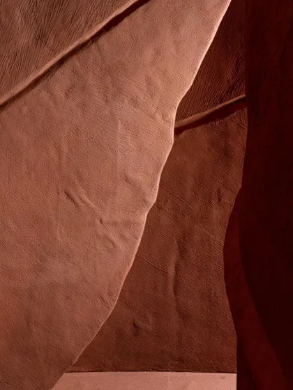 A close-up detail of the 'Terra' sculpture's surface. The subtle texture and gentle curve of the form are designed to be appreciated from both a distance and up close.