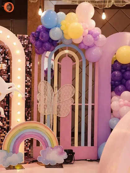 More details from the unicorn stage, including a large carousel unicorn, rainbow props, and pastel balloon arrangements. I love creating these immersive, picture perfect settings.