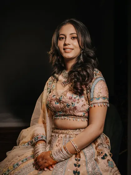 A classic, elegant portrait of the bride-to-be on her engagement day. The soft lighting and her graceful pose create a timeless image.