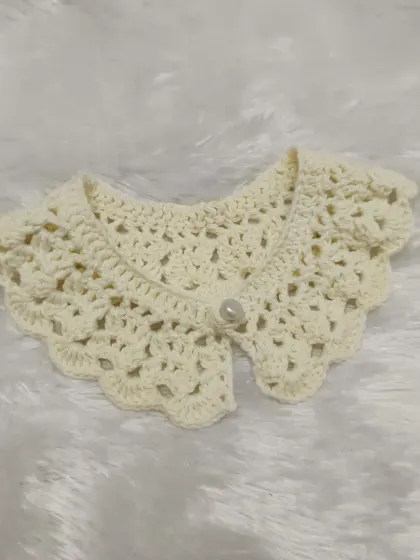 A closer look at the beautiful stitch work on this custom-ordered off-white crochet collar.