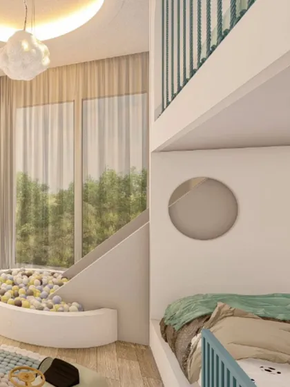 This shot highlights the slide and ball pit area, showing how it connects to the loft bed. The large window allows for plenty of natural light, making the play area feel bright and inviting.