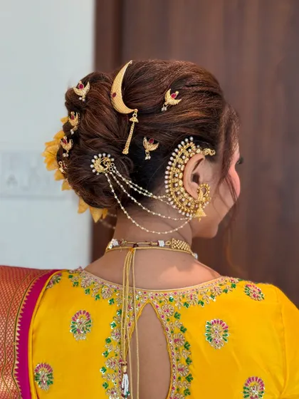 A detailed close-up of the hairpins and accessories that make the traditional Khopa so special and regal.