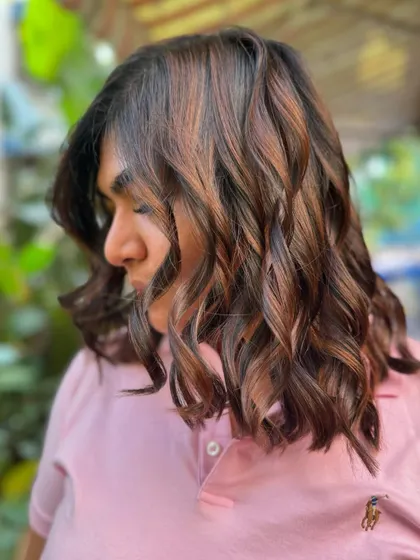 A side profile showing off the subtle layers and rich brunette tones. This is a great look for medium-length hair. (No filter)