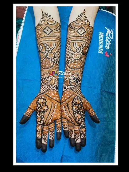 The completed engagement design, featuring a mix of floral, peacock, and geometric patterns for a full and elegant look.