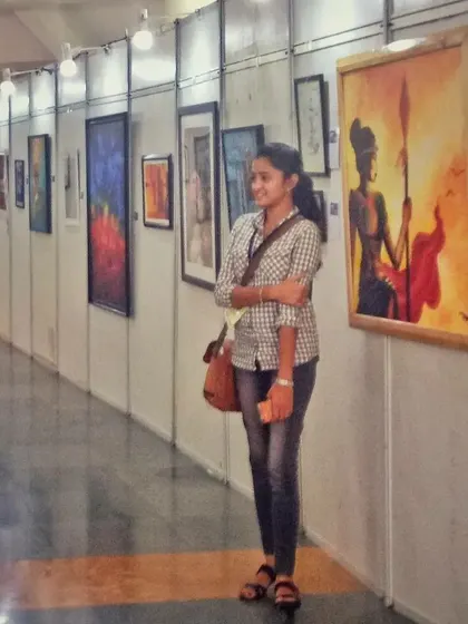 A proud moment for me, standing next to my work at a gallery exhibition. Seeing my art displayed and connecting with people who appreciate it is an incredibly rewarding part of being an artist.