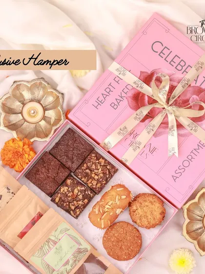 Our Exclusive Hamper is a perfect mid-tier option, featuring a selection of our signature brownies, assorted cookies, and artisanal tea blends. It's a thoughtful package for any corporate occasion.