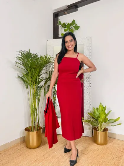 This red dress comes with a matching shrug, but it also looks great on its own as a strappy dress for an evening out. It's a versatile two-in-one outfit.