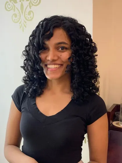 The after shot for Anna's curl transformation. I added layers and bangs to create shape and volume.