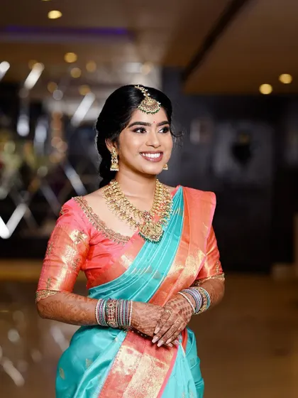 Krithika's engagement look. The peach and turquoise saree is so pretty, and her makeup is fresh and glowing.
