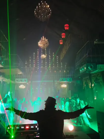 It's all about creating an immersive atmosphere. Here, I'm using a combination of lasers, moving head lights, and chandeliers to transform a club into a high-energy dance zone for a private event. This is how I build the vibe.