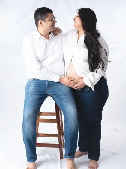 A relaxed and happy couple's portrait. Their casual outfits and comfortable poses create a natural and authentic feel.