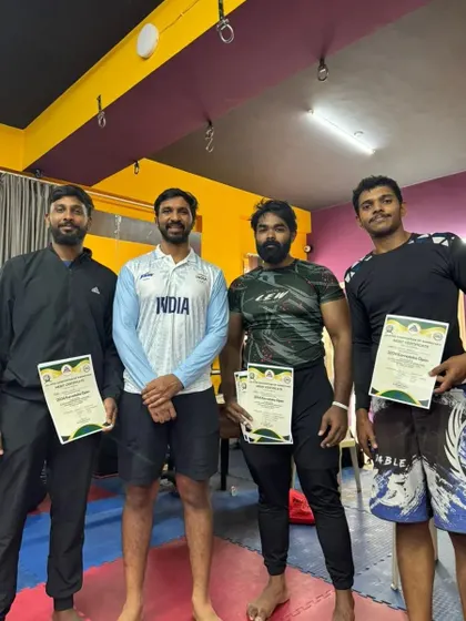 The team holding up their certificates after the Karnataka Open. We celebrate each other's successes.