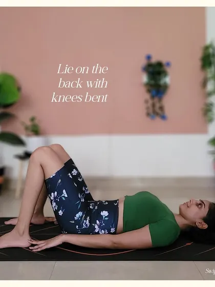 Step 1 for Upward Bow Pose: Lie on your back with your knees bent, feet flat on the floor.