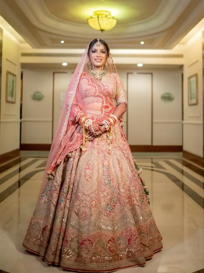 A full view of my best friend and beautiful bride, Shikha. Her makeup was designed to be soft and romantic, complementing her intricately embroidered Rimple & Harpreet lehenga.