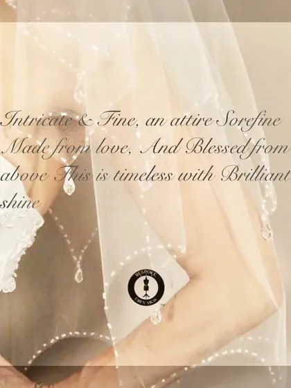 An artistic shot capturing the delicate, timeless beauty of a bridal veil with intricate pearl and crystal work.