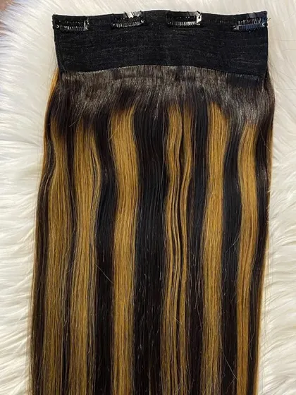 Another look at our highlighted clip-in extensions. The secure clips ensure they stay in place, allowing you to confidently rock your new multi-tonal hairstyle.