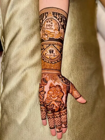 The full arm view of the baby shower mehandi, showing all the custom elements working together.