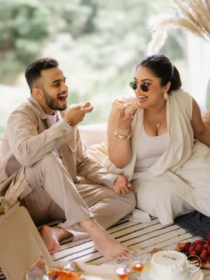 Love should be fun, and your photoshoot should be too. We believe in capturing the real you, whether that means sharing a pizza and laughing uncontrollably during a cozy indoor pre-wedding session. It’s these unscripted, joyful moments that tell your true story.