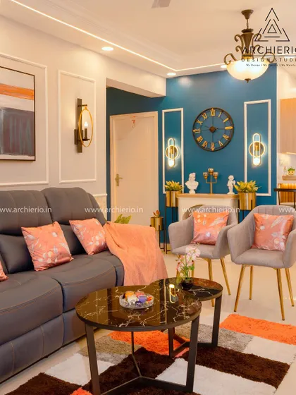 This living room uses a bold teal accent wall to create a dramatic focal point. The classic furniture and decor elements balance the space with timeless elegance.