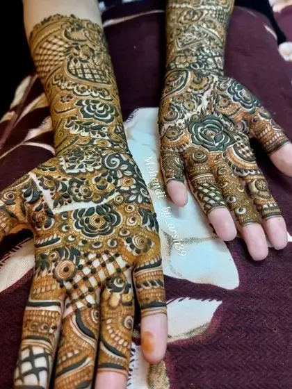 A close-up of a floral and paisley bridal design.