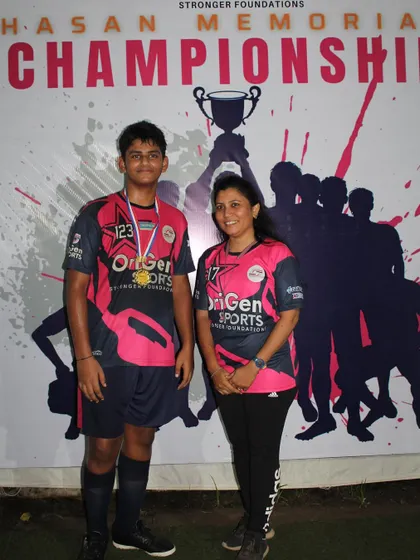 A top performer from the Hasan Memorial Championship posing with a parent. We are proud to recognize the players who gave their all during the tournament.
