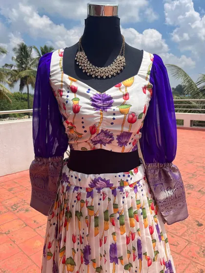 A variation of the floral lehenga with deep purple puff sleeves.