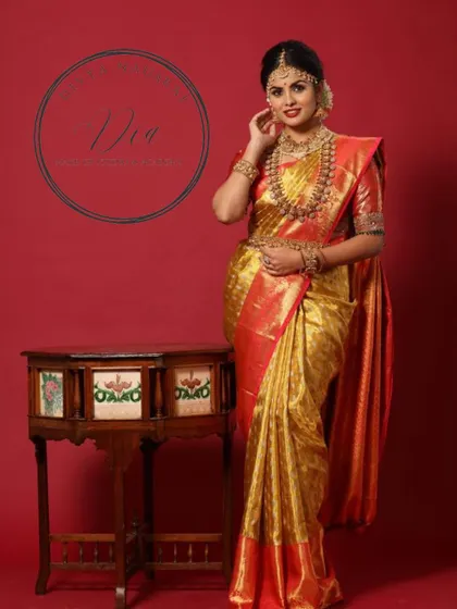 Another pose from the same shoot, highlighting the intricate details of the jewellery and the saree. The makeup remains the focal point, creating a look of timeless beauty and poise.