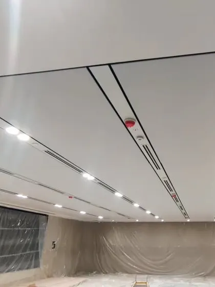 Another angle of the soundproof ceiling, showing the precision of the panel installation. This type of ceiling is highly effective for boardrooms, conference rooms, and open-office areas.