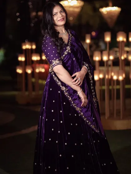 Another look at the custom purple velvet lehenga, showing its beautiful drape and the intricate embroidery along the border and blouse.