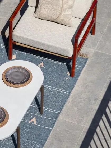 An overhead view of the expansive deck at the Max128 apartment. This space was designed as an urban oasis, blurring the line between indoor comfort and outdoor living.