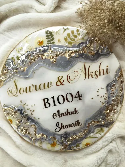 A beautiful geode nameplate in grey and white with gold accents. This piece was modified based on client input to add a darker grey for more contrast.
