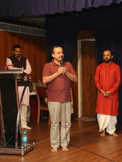 An audience member sharing his thoughts during our anniversary celebration. Open dialogue and feedback are crucial for the growth of our community and our programs.