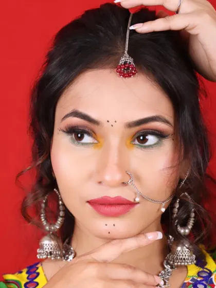 A detailed portrait of the Navratri makeup. The look is completed with a traditional nose ring and bindi, perfect for the festive occasion.