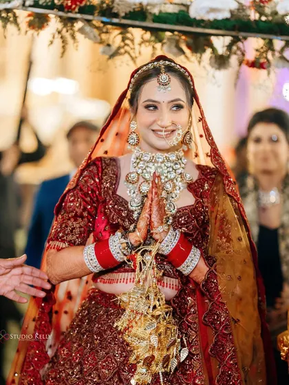 The bride's grand entrance, looking radiant and happy as she walks towards the ceremony.