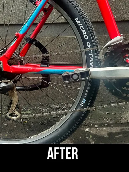 A close-up of the serviced drivetrain on the red Trek. The clean chain, cassette, and derailleur are ready for action.