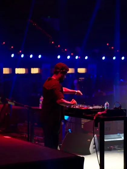 Adjusting the mix on a huge stage. Even in a large venue, my focus is on the fine details of the sound to ensure a perfect experience.