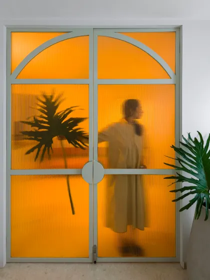 We believe a touch of the unexpected can transform a space. This bold, translucent yellow door is a perfect example, casting a warm, artistic glow and turning a simple entryway into a memorable design moment. It proves that even a single pop of color can shift the entire mood of a home.