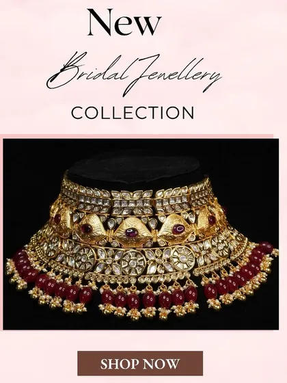This new addition to our rental collection features a stunning choker with deep red beads, perfect for a bride seeking a dramatic and royal look.
