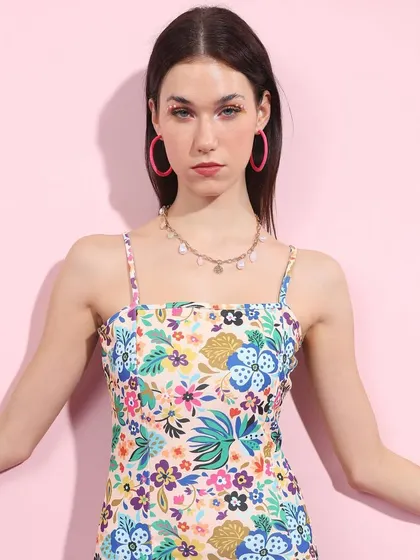 This floral dress brings a different texture to the Barbiecore theme. I styled it with bright pink hoop earrings to tie into the color palette and keep the look playful.