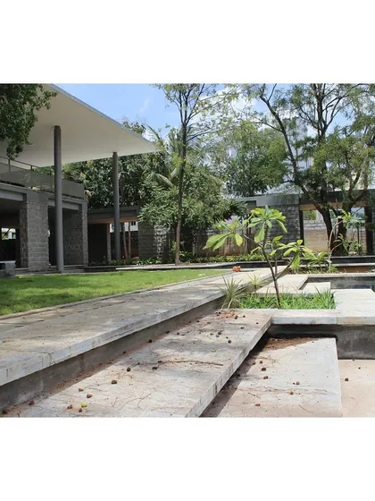 The steps leading down to the water body, integrated with the landscape.