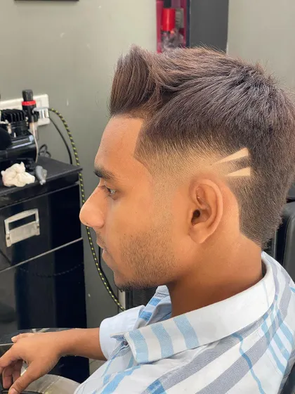 Another angle of this sharp fade, highlighting the clean lines of the geometric hair tattoo. The style is modern and perfect for anyone wanting a unique touch.