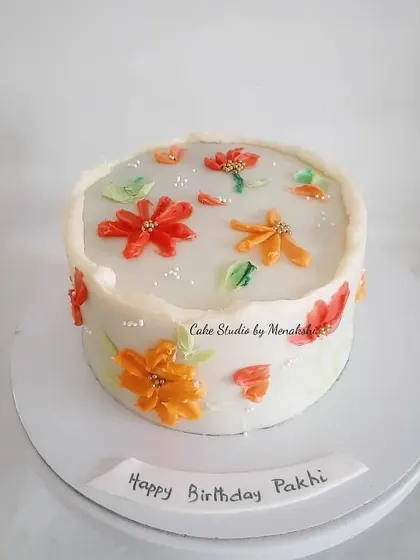 The vibrant colors on this floral cake are created entirely with hand-piped buttercream using a palette knife technique. A beautiful, artistic cake made without any fondant.