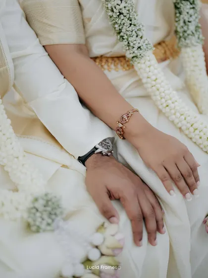 A close-up on their intertwined hands, a simple yet powerful symbol of their new union. We believe in capturing the details that matter.