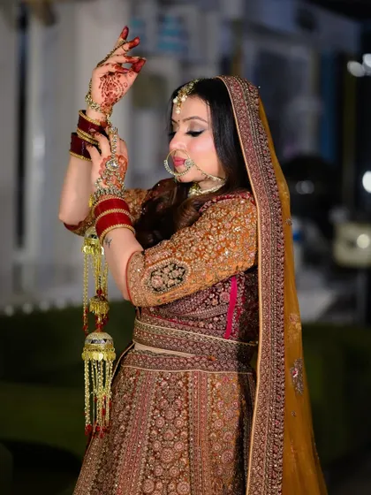 A classic bridal pose showing off the intricate henna and the traditional kalire. This portrait highlights the important details of the bridal look.